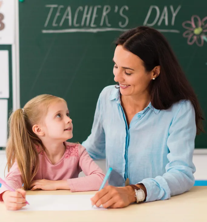 A teacher helping a student.
