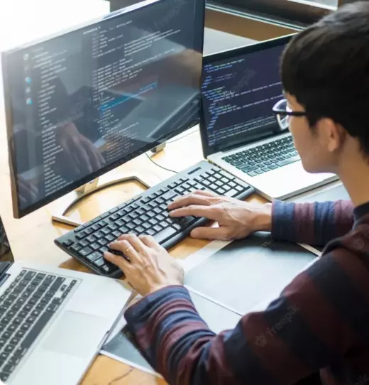 A software engineer writing the code for a software application.